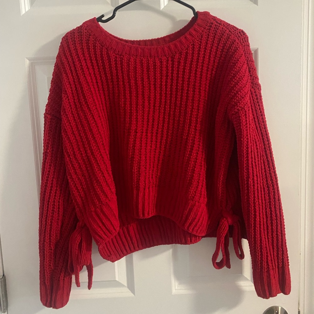 Red knit sweater with bows